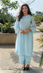 Woman wearing भू weave cotton kurta pant set , outdoor shoot
